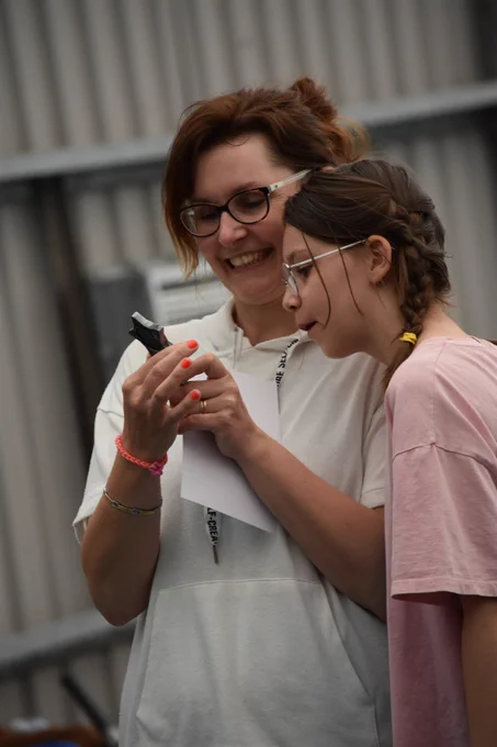 A parent and child from last year's event admiring their trophy.