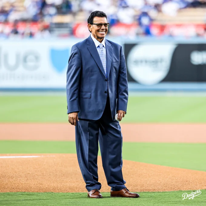 A photo of Fernando Valenzuela standing on the field at Dodger Stadium.