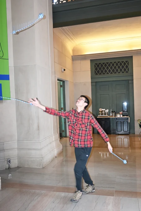 Student juggling in MIT's lobby 7.