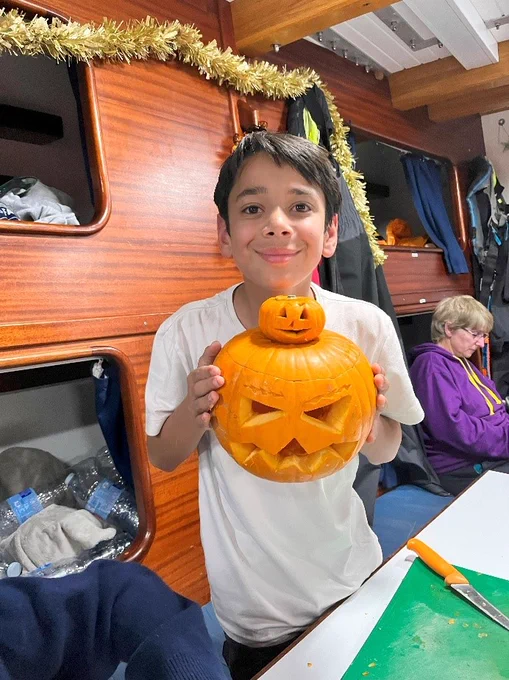 Crew member with carved pumpkins