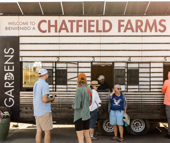 A group of people waiting to start the tour of Denver's newest solar garden and agrivoltaic demonstration at Denver Botanic Gardens Chatfield Farms.