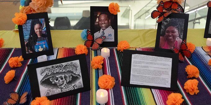 Among the framed photos are pictures of Jonathan D. Daniels, MD ’98, our beloved former associate director of admissions, and two of his adult daughters: Jordan and Jensen. The three died tragically in a July 2022 fire.
