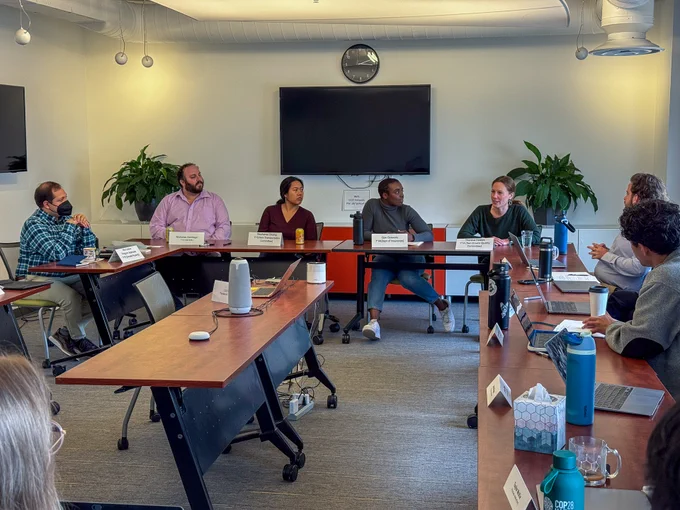 A view from the back of the room of the alumni panel.