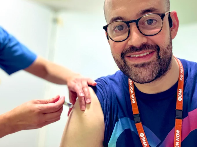 Dr. Andrew getting vaccinated for Covid and Influenza.