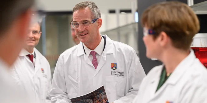 Peter Kyle meets with researchers at the Molecular Sciences Building at the University of Birmingham. 