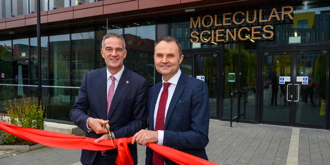 Peter Kyle cuts the ribbon for the Molecular Sciences Building with Adam Tickell, Vice-chancellor of the University of Birmingham.
