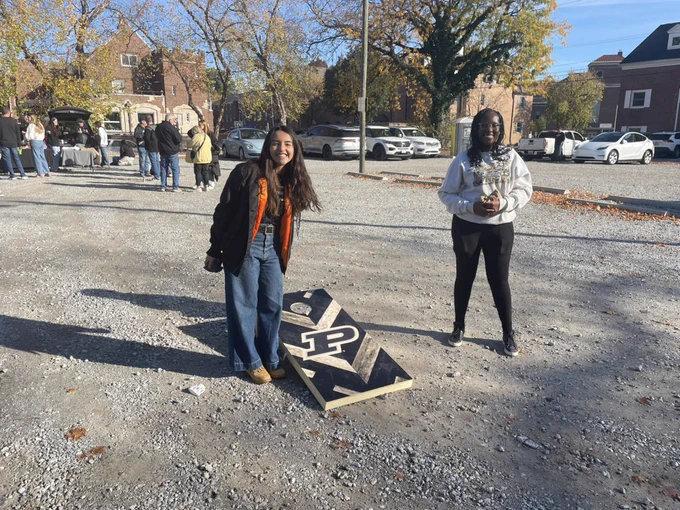 Mariana and Sedi playing cornhole