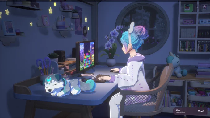 This is a screenshot from Spirit City. A girl with blue and pink hair and a purple and white hoodie sits at a desk. She is playing a video game on a black PC. A grey, white, and blue dog spirit sleeps to the left on the desk. The walls are covered in white shelves with gaming merch, photo frames, plushies, and knick-knacks. 