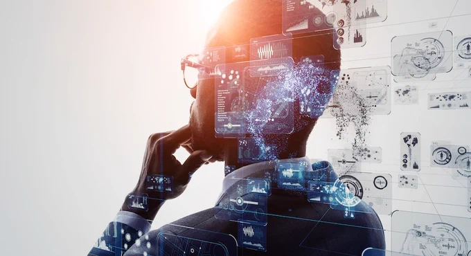 A person thinking with images of data and graphs behind them.