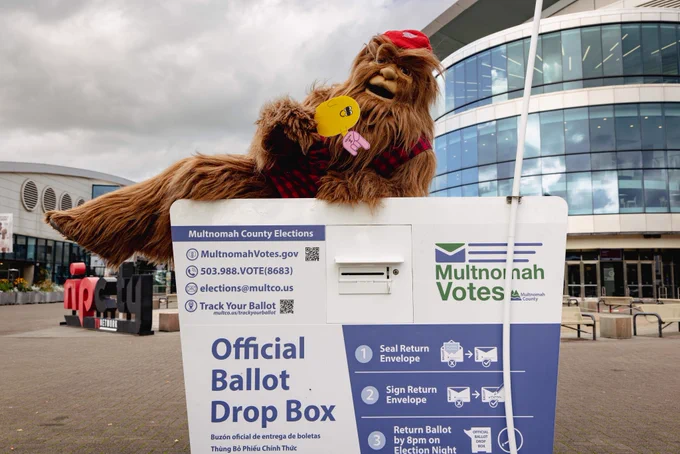 Blobby with Douglas Fur sat on top of the Multnomah County official ballot dropbox