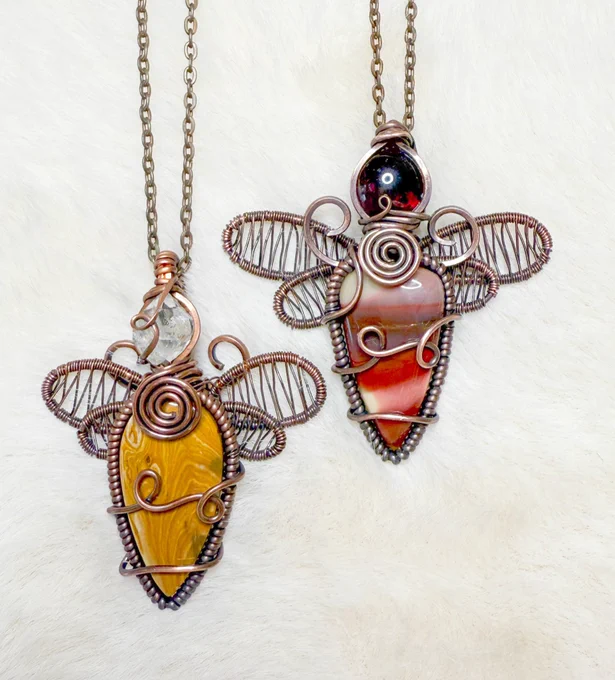 The left dragonfly fairy is herkimer diamond & dolomite. The right is garnet & mookaite