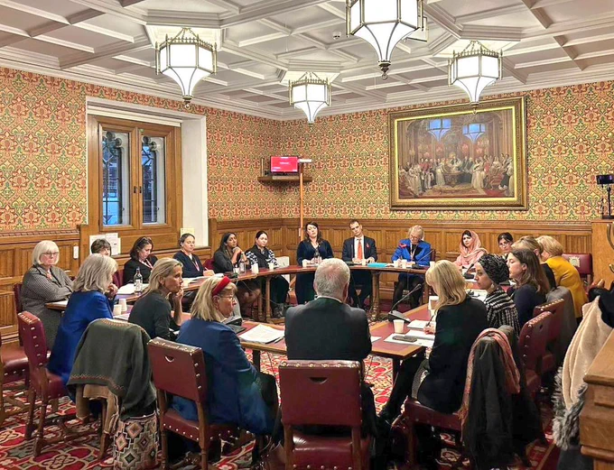 Board room with malala and elected members round the table 