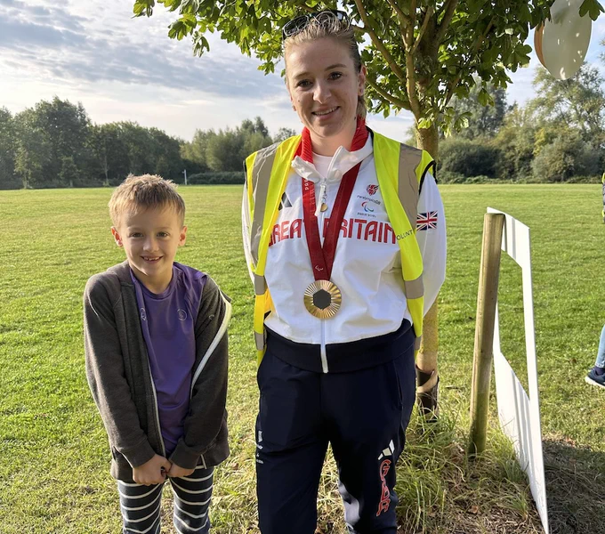 Image of Hannah Moore and a junior parkrunner