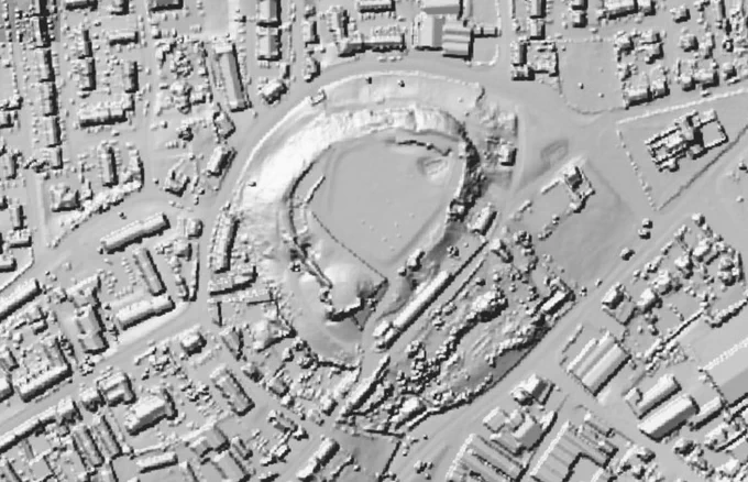 Lidar imge of Pontefract Castle and surrounding buildings. It shows how the castle site is raised above the surroundings, maps the outline of the walls, and has a few little dots where the picnic benches are.