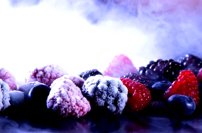Image shows frozen raspberries, blueberries and blackberries
