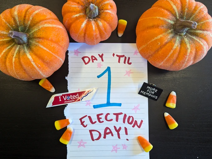 Photo of a sheet of paper saying "1 Day 'Til Election Day" surrounded by pumpkins, candy corn, and a TN "I voted!" sticker.