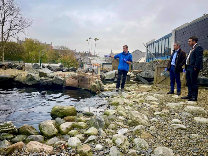 Pictures of Minister Muir at Exploris Centre in Portaferry and the Portaferry regeneration scheme.