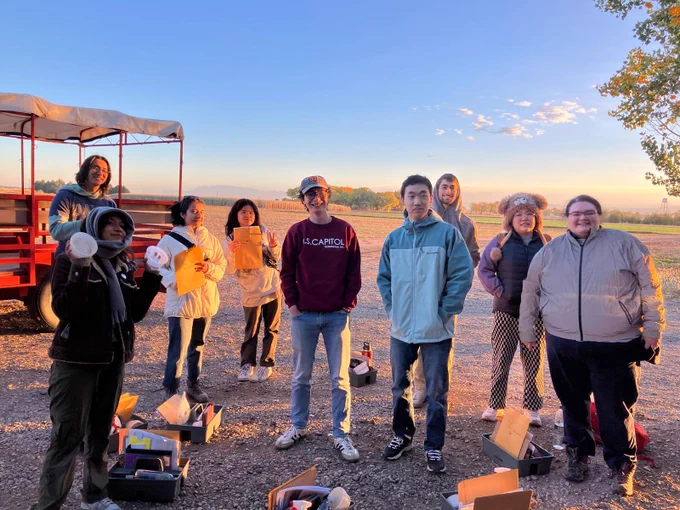 Students smile for picture with soil supplies