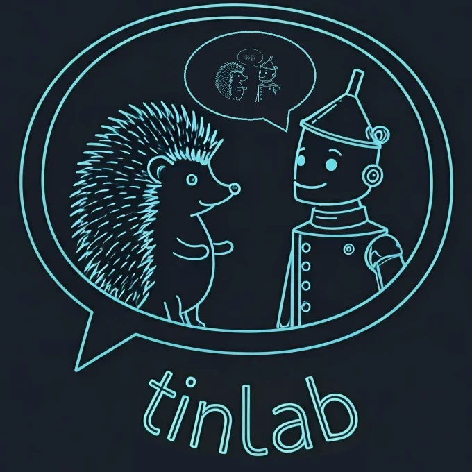 A logo of tinlab that shows a hedgehog and a tin man chatting about a hedgehog and a tin man chatting about a [...]