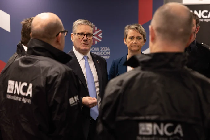 Prime Minister Keir Starmer and Home Secretary Yvette Cooper speak with police officers as they attends the Interpol General Assembly.