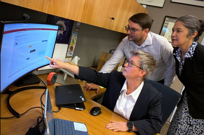 Dr. Joni Rutter and her colleagues Dr. Tyler Beck and Dr. Christine Colvis discuss a knowledge graph produced by the Biomedical Data Translator tool. 
