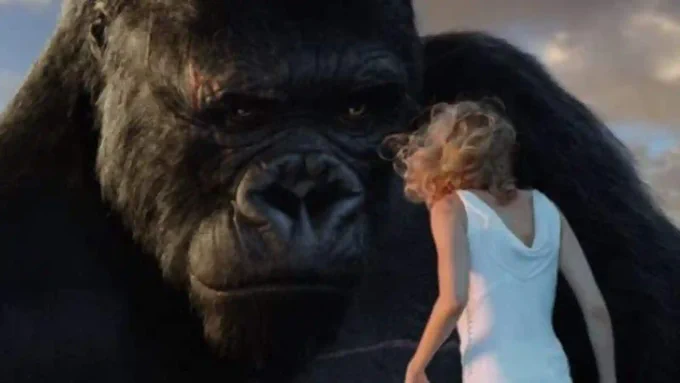 On the right, a still from the 2005 version of KING KONG showing the ape's face close up as he scrutinizes a blonde woman in a white gown standing before him.