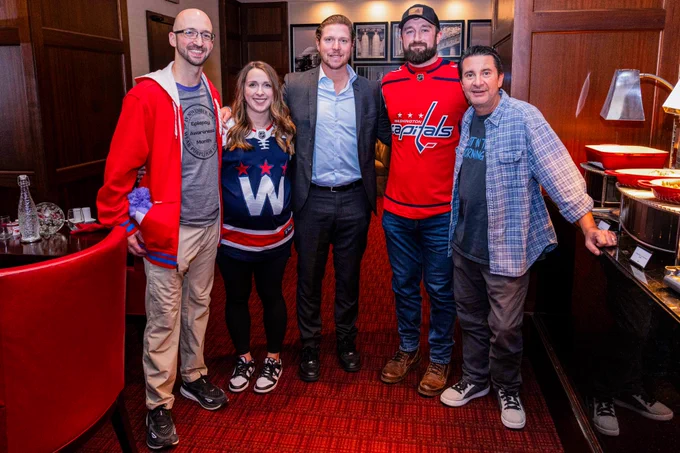 So Kids Can sweeps winner Corey and his two friends pose for a photo with Nicklas Backstrom and Elliot Segal.