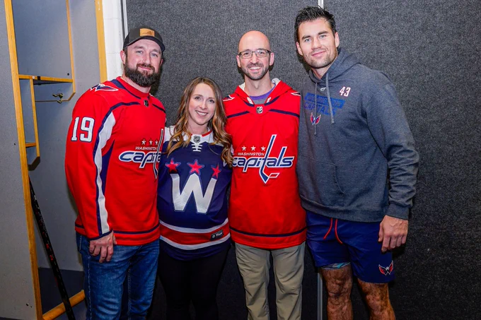 So Kids Can sweeps winner Corey and his two friends pose for a photo with Tom Wilson.