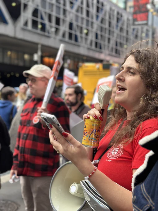 Unit member Sierra Saitta leads crowd in chant