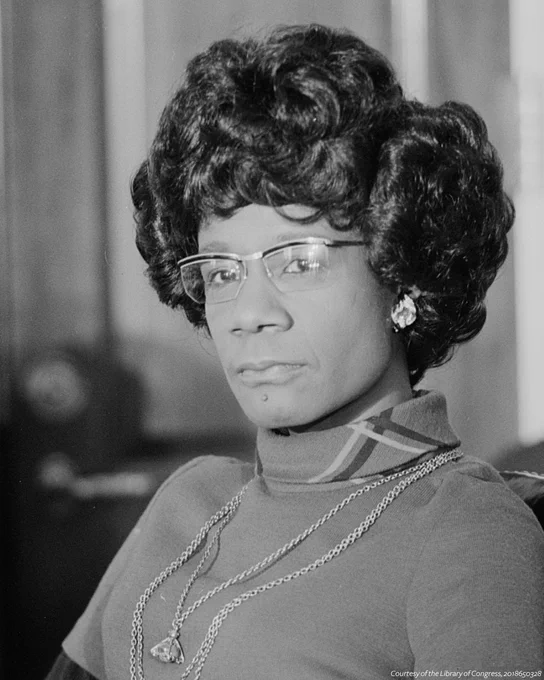 A black and white portrait of  Shirley Chisholm. 