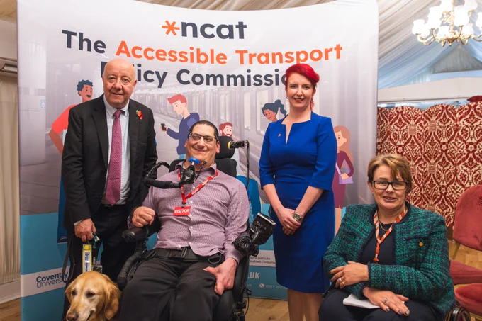 Image taken in front of an Accessible Transport Policy Commission banner. L-R: Steve Darling MP, Clive Gilbert, Louise Haigh MP, and Baroness Tanni Grey-Thompson. 