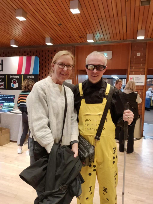 Photo of CENMAC Deputy Head Mary Long with Braille Artist Clarke Reynolds at the Site Village today at Kensington Town Hall in London.