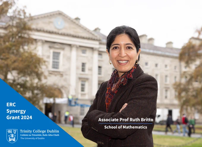 Professor Ruth Britto, wearing a dark jacket, on the Exam Hall Steps in Trinity's Front Square.