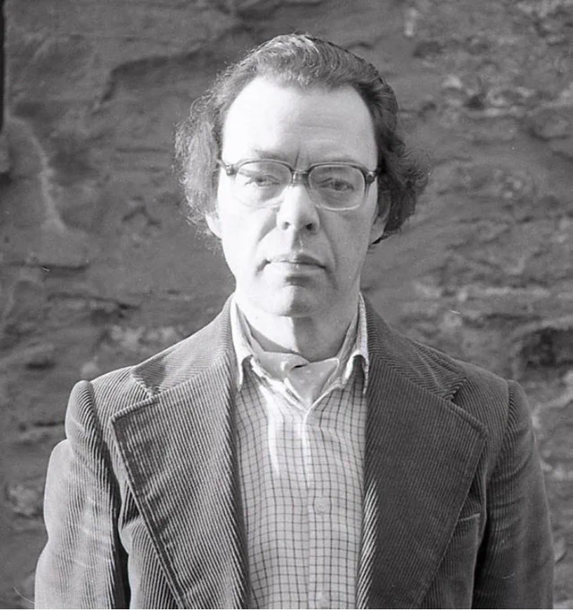 Black and white photograph of Robert James Hayhurst looking at the camera.