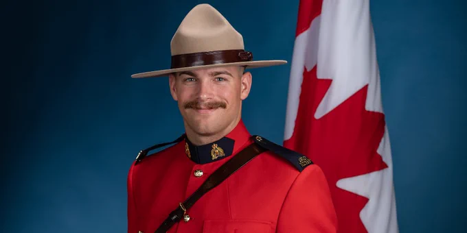 A graduation portrait of a man in Red Serge.