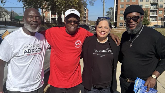 Photo of three voters and me with our arms around each other smiling.