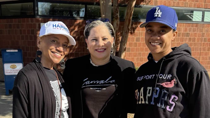 Photo of two voters and me in Richmond smiling.