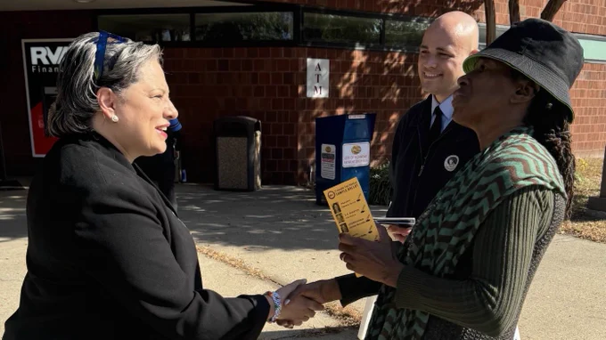 Photo of me greeting voters at the polls in Richmond.