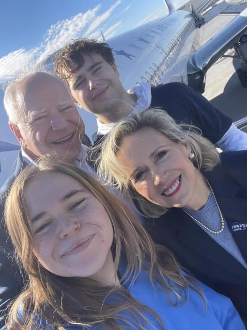 Walz family selfie in front of a Harris-Walz airplane.