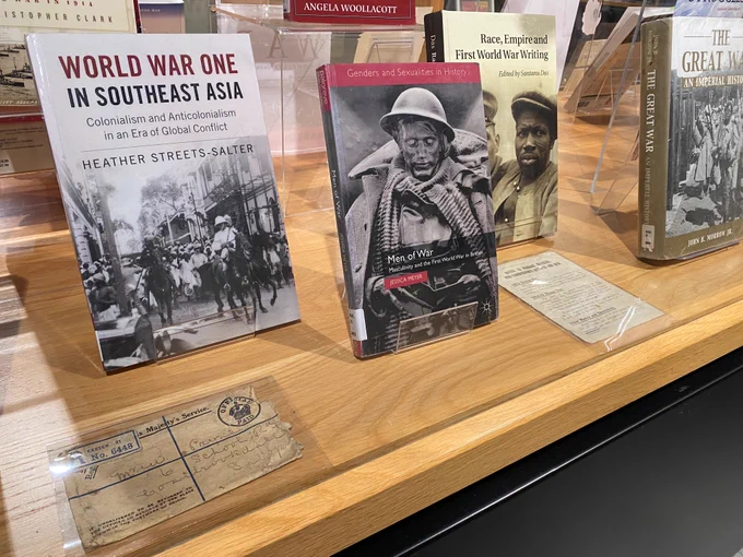 Image shows a closeup of the inside of the library remembrance display with books and archive items 