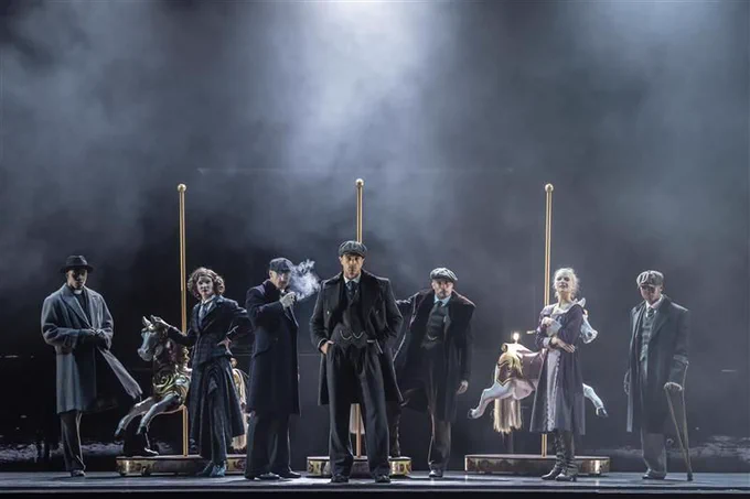 A group of theatre performers on stage.