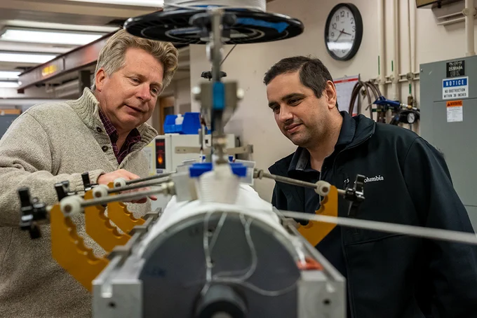 Soren Prestemon (left), head of ATAP's Superconducting Magnet Program, and Diego Arbelaez, a staff scientist in the Engineering Division at Berkeley Lab, discuss the winding tooling design used for the Electron Cyclotron Resonance sextupole magnets for Michigan State University’s Facility for Rare Isotope Beams, the world’s most powerful heavy-ion accelerator