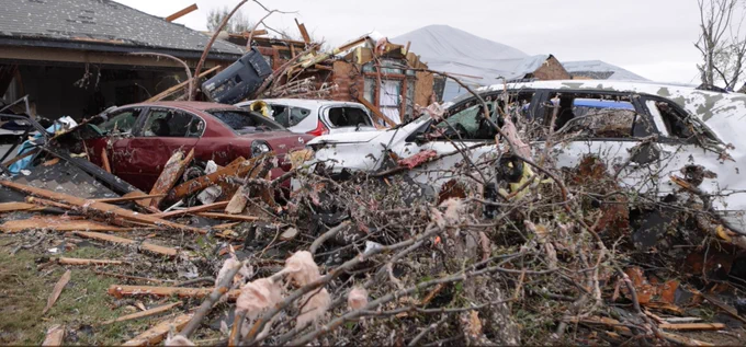 houses, cars and downed trees destroyed because of tornado