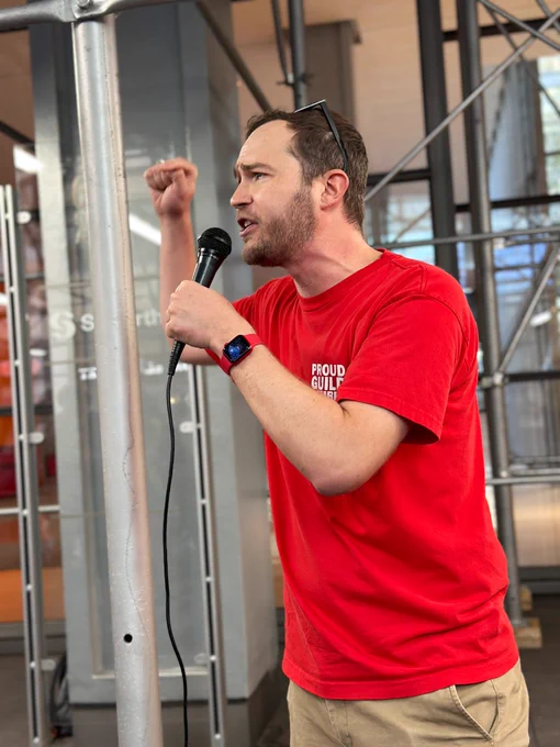 NewsGuild president Jon Schleuss speaking to a crowd