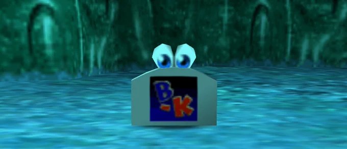 A Googly Eye-attached Banjo-Kazooie N64 cartridge in an icy cavern off from Jinjo Village.