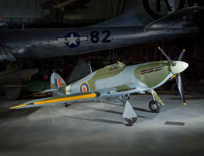 Green and blue-grey aircraft with Royal Air Force insignia on it on display at the Udvar-Hazy Center.