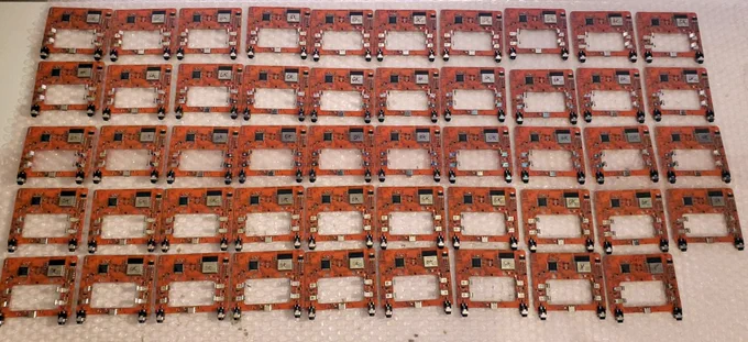 49 production Pickup circuitboards in a retro orange color.