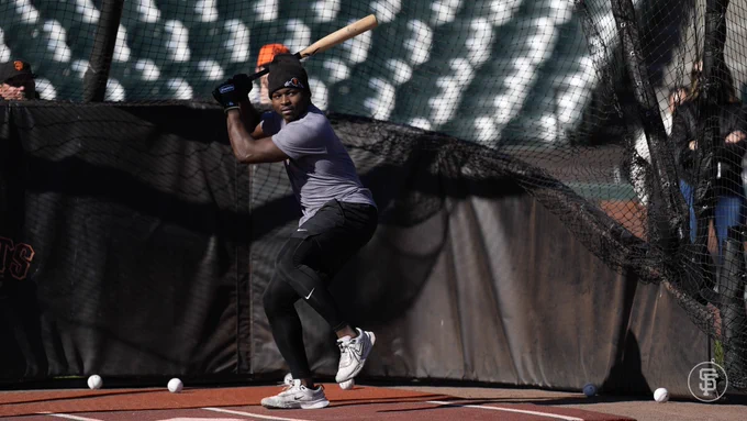 Dakota Jordan in the batting cage while taking on-field BP