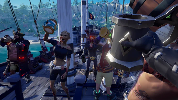 A bunch of pirates toasting “to absent friends”, a beautiful blonde pirate in the middle taking the command