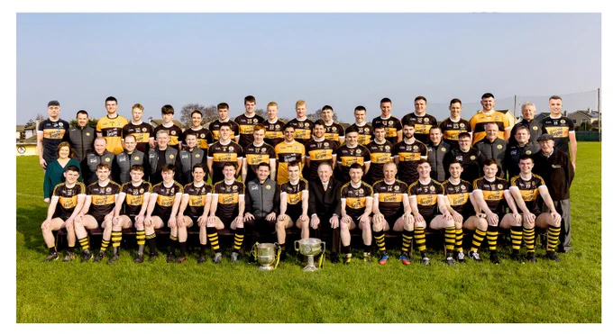 Austin Stacks: Kerry County Football Champions & Kerry Senior Club Champions 2021
Front Row L/r - Luke Chester, Donagh McMahon, Jordan Kissane, Michael O’Gara, Ronan Shanahan, Darragh O’Brien, Wayne Quillinan (Team Manager), Dylan Casey (Team Captain), Billy Ryle (Club Chairman), Conor Jordan, Kieran Donaghy, Greg Horan, Dara Barry Walsh, Ciarán O’Connell, Seán Quilter.

Middle Row L/r – Elma Nix (Club Secretary), Kieran Shannon, Eoin Colgan, Jonathan Conway, Damien Ryall, Joseph O’Connor, Shane O’Callaghan, Wayne Guthrie, Barry Shanahan, Colin Griffin, Fiachna Mangan, Gearóid Fitzgerald, Fionnan Hallinan, Matthew Browne, Tommy Naughton, John O’Sullivan, Martin Collins (Club PRO).

Back Row – Jack O’Shea, Mikey Collins, Ben Quilter, Gearóid Sheehan, Cian Purcell, Andrew Morrissey, Armin Heinrich, David Fitzmaurice, Barry Walsh, Joey Nagle, Paul O’Sullivan, Adam Curran, Niall Fitzmaurice, Brendan O’Sullivan, Jack Morgan, Robbie Murphy, Éamonn O’Reilly (Club Vice-Chairman), Michael O’Don